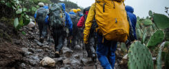 A group of hikers in the gray and rainy highlands on Mount Kilim